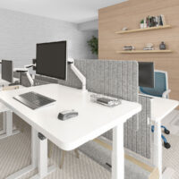 S Collection height adjustable desk with Envoy monitor arm, Aura dividers, and Ivy power & data beam